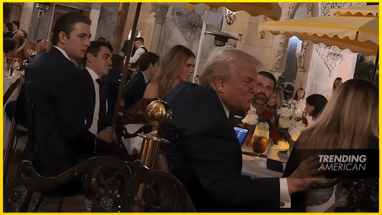 Shy Barron Trump keeps to himself as he sits next to his father at Mar-a-Lago festive dinner