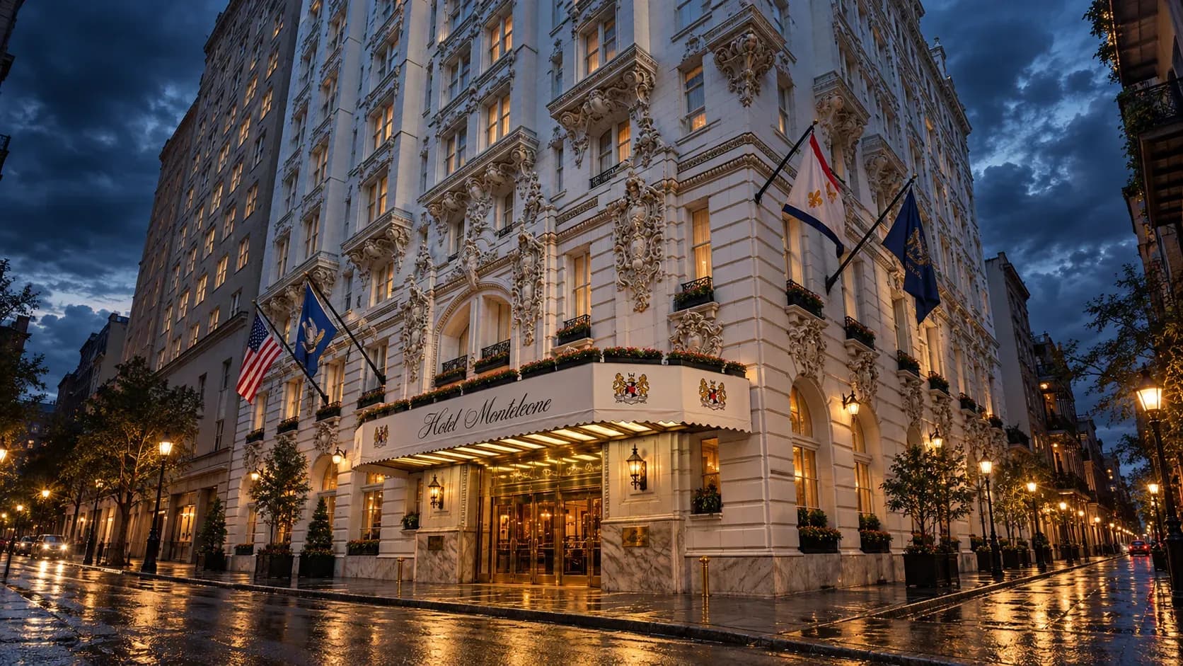 Hotel Monteleone illuminated beneath storm clouds on a rain-soaked evening in New Orleans.