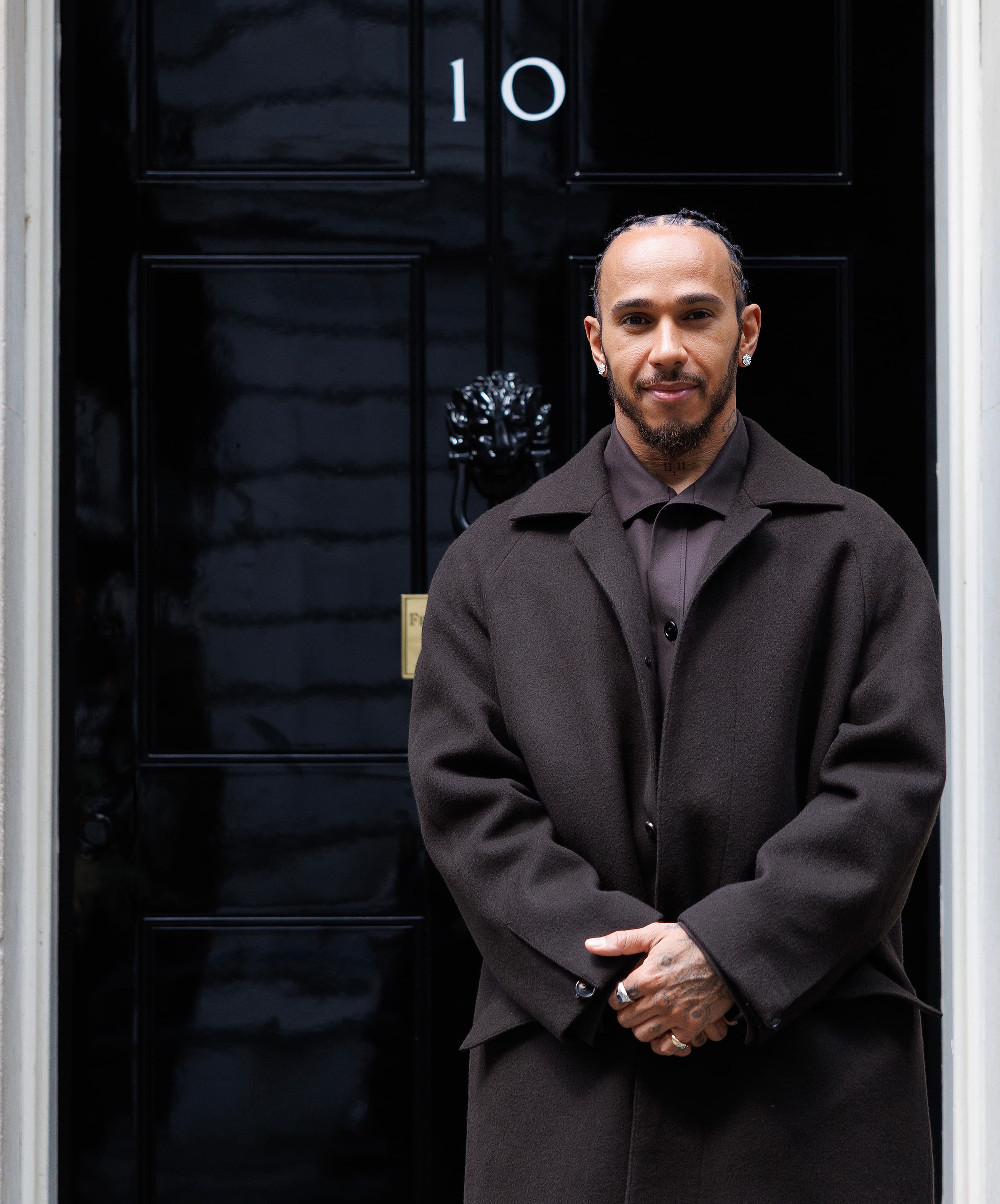 Lewis Hamilton standing outside 10 Downing Street in London in June 2025