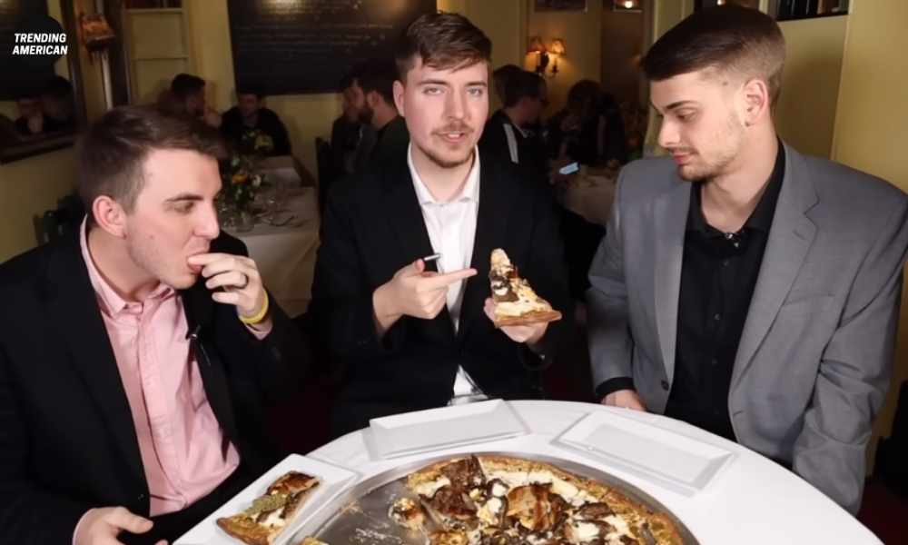 MrBeast and his friends are eating a $70,000 Golden Pizza.
