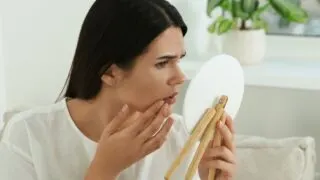 women checking her skin